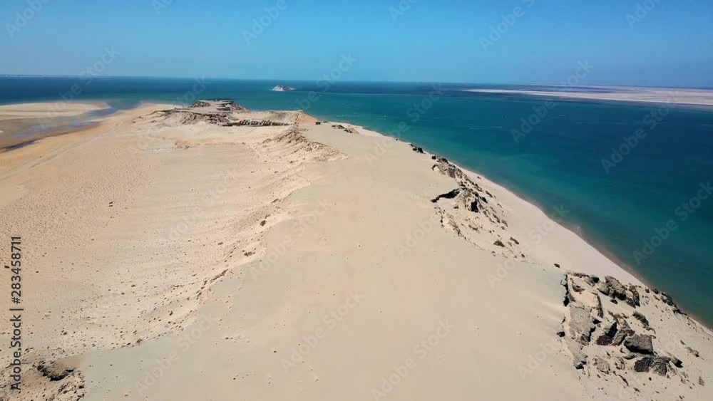 Aerial Forward: Amazing Sand Dunes by Beautiful Blue Ocean, Dahkla, Morocco Aerial Forward: Amazing Sand Dunes by Beautiful Blue Ocean, Dahkla, Morocco