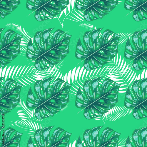 Green pattern with monstera palm leaves on dark background. Seamless summer tropical fabric design.