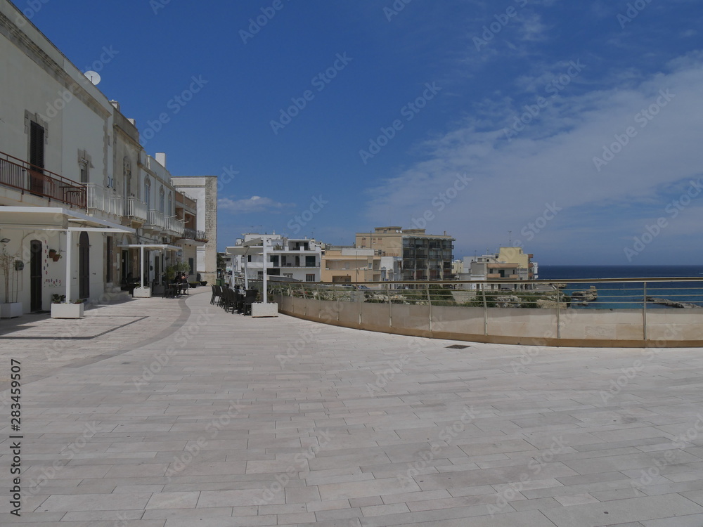 Otranto panorama of the beach and of the southern promenade. Otranto sandy beach and its white southern promenade are located on the Adriatic coast of Salento, Italy.