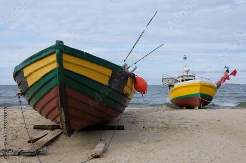 Wooden fishing boats on the beach of Baltic Sea in Sopot Poland. 