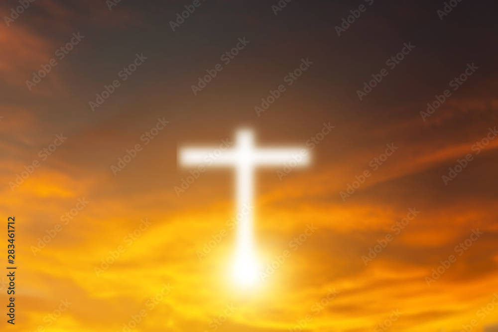 Conceptual wood cross or religion symbol shape over a sunset sky with clouds background for God. belief or resurrection of god and worship christian. sky freedom.