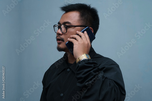Young man listening to a mobile call