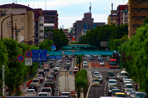 A timelapse of car street at Kanpachi avenue in Tokyo daytime photo