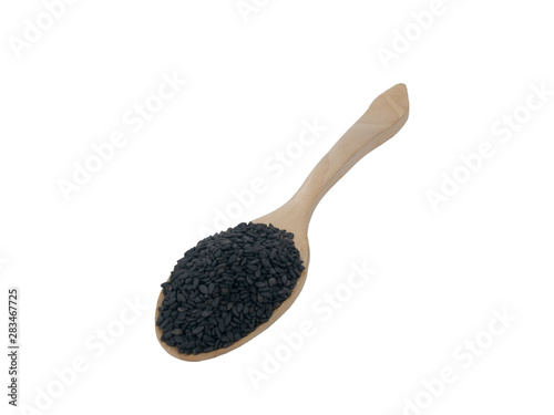 Black Sesame seeds on wooden spoon isolated on white background.Organic natural sesame seeds and extract oil concept
