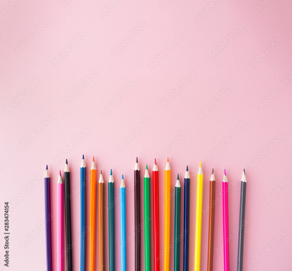 Color pencils on pink background close up with Clipping path..Color pencils for drawing Rainbow. Copypaste, flat lay Color pencils on pink background close up with Clipping path..Color pencils for drawing Rainbow. Copypaste, flat lay