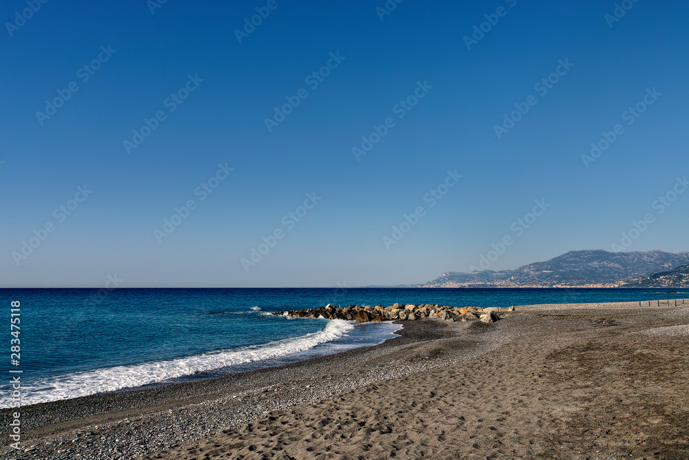 deserted beach in the morning in Bordighera in Liguria in Italy