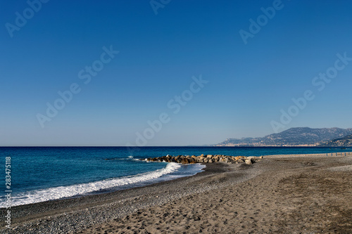 deserted beach in the morning in Bordighera in Liguria in Italy