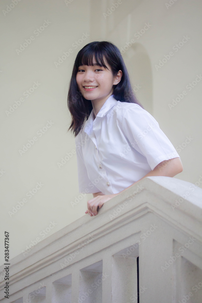 Portrait of thai adult student university uniform beautiful girl relax and smile Portrait of thai adult student university uniform beautiful girl relax and smile