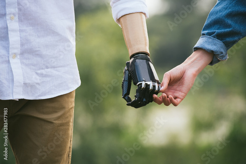 CloseUp Shot Of Man With a prosthetic limb Holding Hands With Female Partner photo