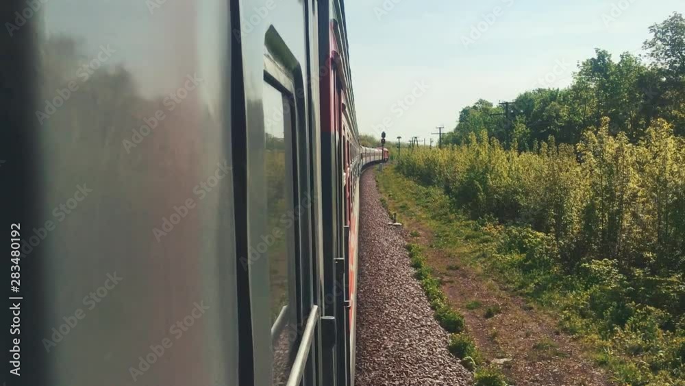 railroad travel concept. locomotive train with passenger wagon carriages moving by rail in lifestyle nature beautiful view outside. tourism travel by the rail