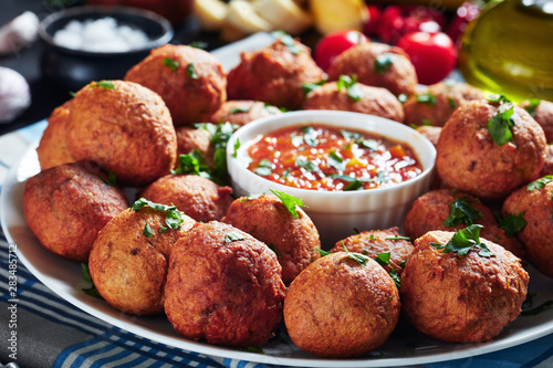 фотографія spicy Plantain fritters Klako on a white plate