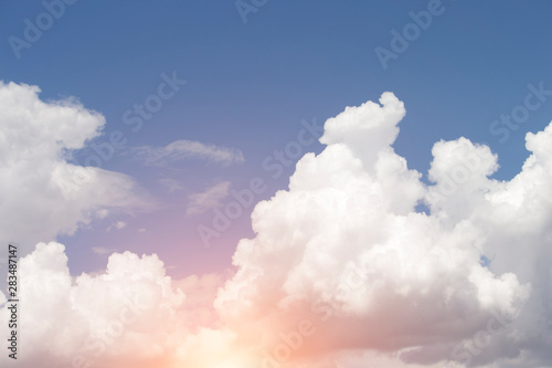 Cloudy in the bright blue sky with the sun light that passes through the clouds © Nattawut