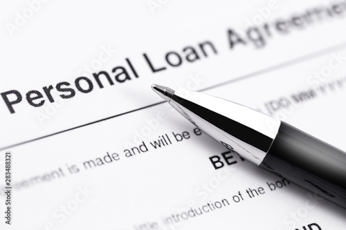 personal loan application form with black pen closeup © prima91