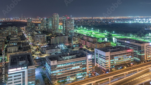 Tecom, Barsha and Greens districts aerial view from Internet city night timelapse