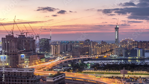 Palm Jumeirah Highway bridge aerial day to night timelapse. Dubai, United Arab Emirates