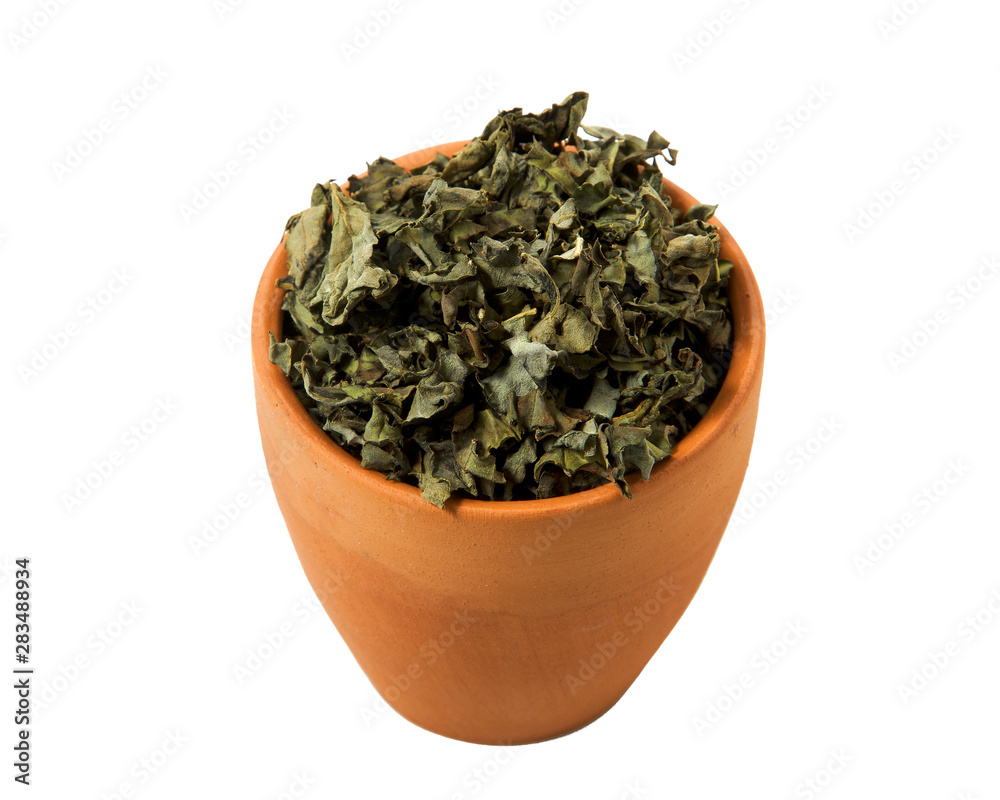 A mixture of seasonings in a bowl isolated on a white background. Spice on isolate. View from above.