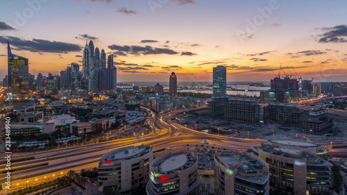 Dubai Media City with Modern buildings aerial day to night timelapse, United Arab Emirates