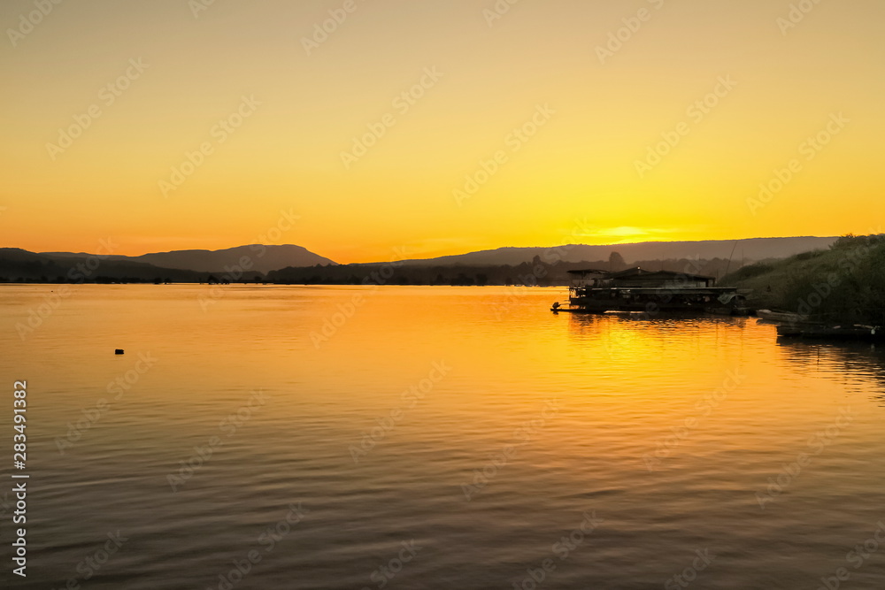 view morning of Mekong river with the hill and yellow sun light background, sunrise at Khong Chiam, Ubon Ratchathani, North-eastern of Thailand.