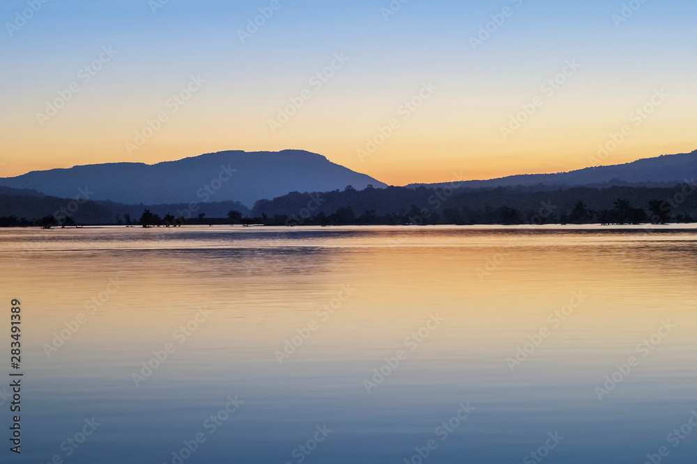 view morning of Mekong river around with the hills and orange sun light in the sky background, sunrise at Khong Chiam, Ubon Ratchathani, North-eastern of Thailand.