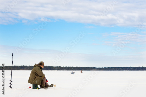 winter fishing Fisherman enjoying a day on the ice