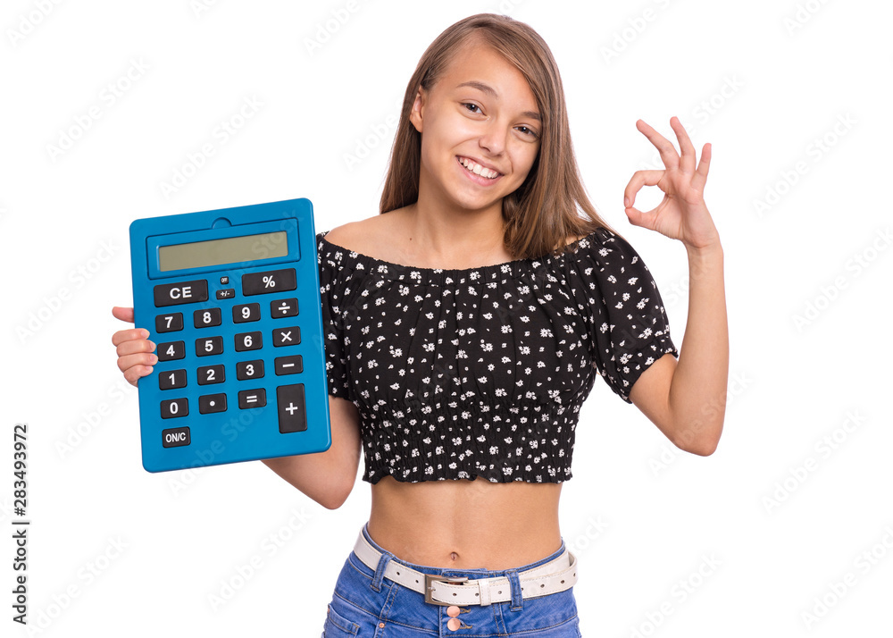 Smart female student holding big calculator and making Ok Gesture. Portrait  of cute teen girl, isolated on white background. Happy cheerful child  showing okay and looking at camera. Back to school. Stock