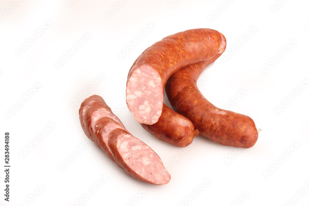 Thin sausage on a white background. Food product. Thin sausage on a white background. Food product.