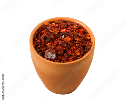 Mix of slices of peppers in a bowl isolated on a white background. View from above.