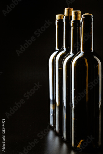 Wine bottle on a dark black background