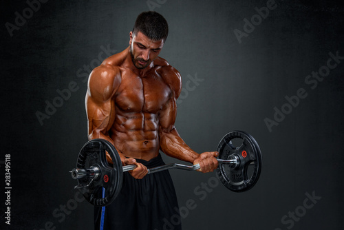 Strong Muscular Men Lifting Weights