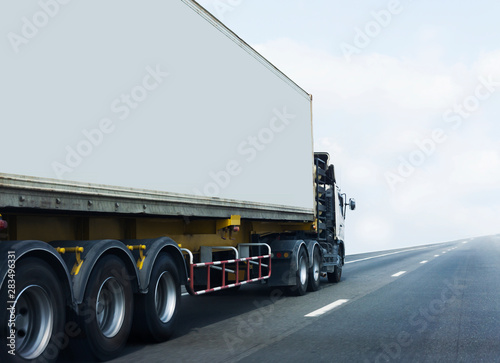 White Truck on highway road with container, transportation concept.,import,export logistic industrial Transporting Land transport on the asphalt expressway