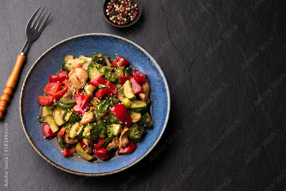 vegetable stir fried on blue plate vegetable stir fried on blue plate