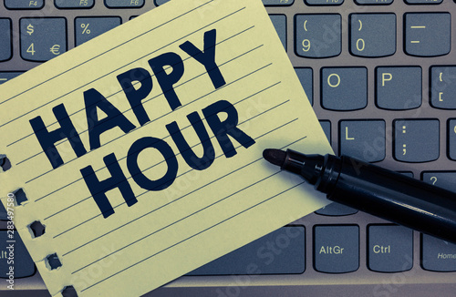 Conceptual hand writing showing Happy Hour. Business photo showcasing Spending time for activities that makes you relax for a while Notebook paper keyboard Inspiration computer black marker photo