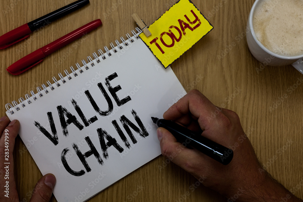 Handwriting text writing Value Chain. Concept meaning Business manufacturing process Industry development analysis Man holding marker notebook clothespin reminder wooden table cup coffee Handwriting text writing Value Chain. Concept meaning Business manufacturing process Industry development analysis Man holding marker notebook clothespin reminder wooden table cup coffee