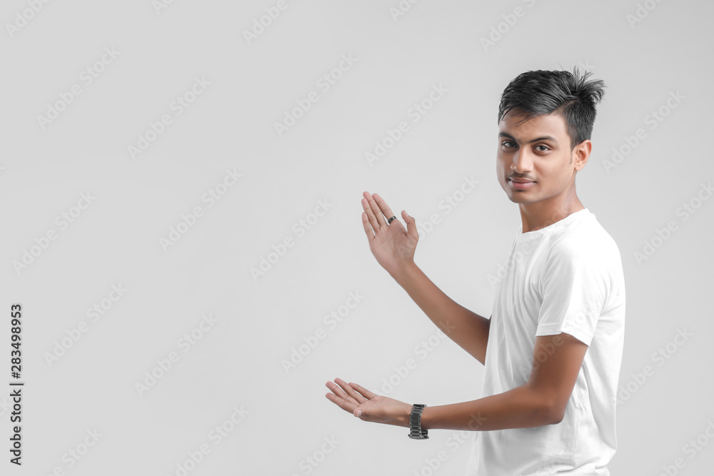 young Indian man giving multiple expression.