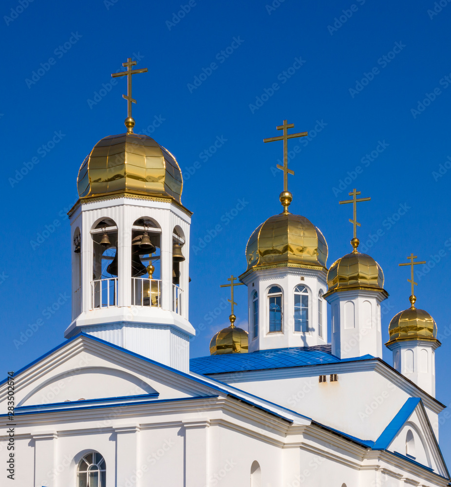 Golden Church domes with crosses and bells