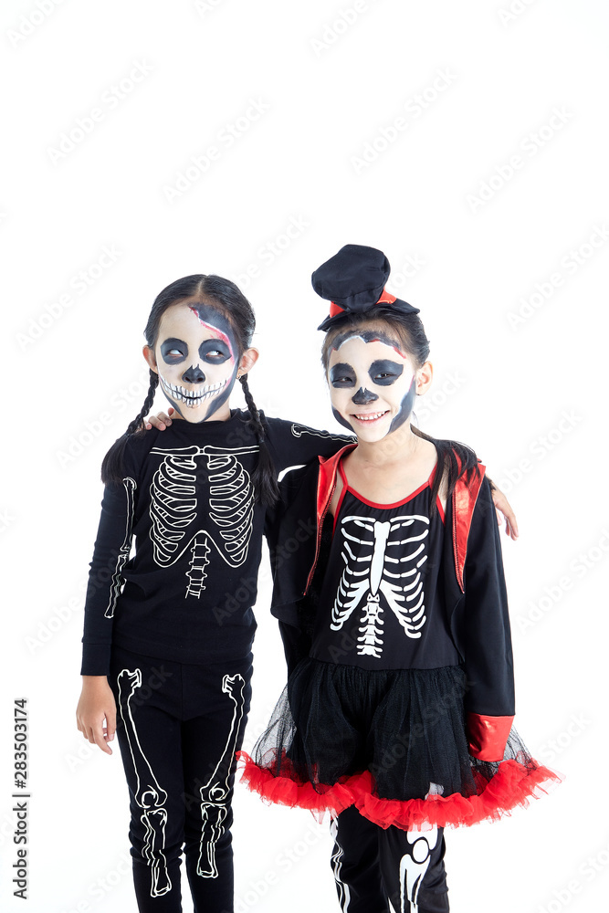 Asian Kids with face-paint and Halloween costumes Asian Kids with face-paint and Halloween costumes
