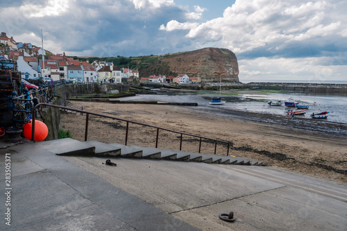 Staithes is a seaside village in the Scarborough Borough of North Yorkshire, England. Easington and Roxby Becks, two brooks that run into Staithes Beck photo