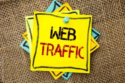 Text sign showing Web Traffic. Conceptual photo Internet Boost Visitors Audience Visits Customers Viewers written Sticky Note Paper attached to jute background with Thumbpin it. photo