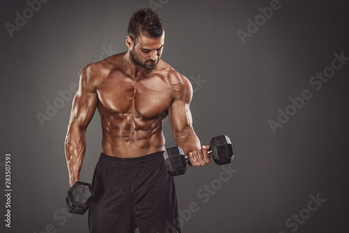 Muscular Athletic Men Exercise With Dumbbells