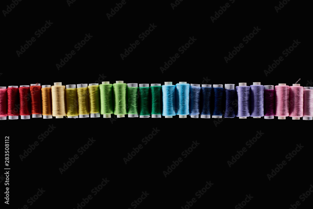 top view of bright and colorful threads isolated on black top view of bright and colorful threads isolated on black
