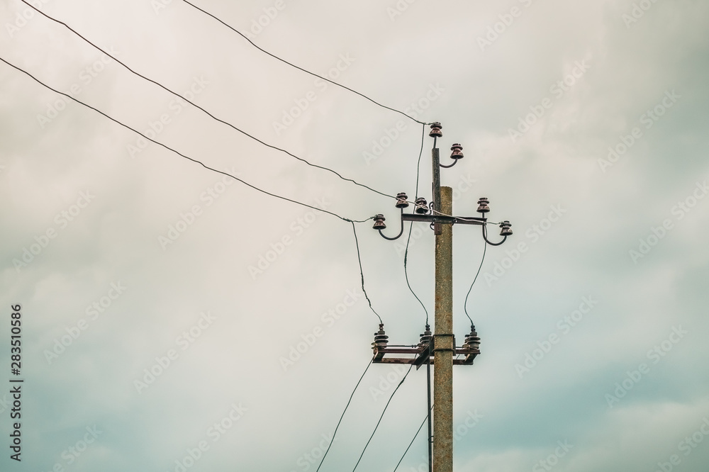 Electric pole with ceramic insulators and wires Electric pole with ceramic insulators and wires
