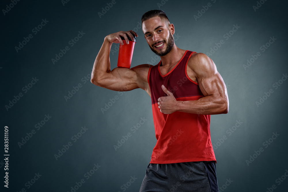 Handsome Muscular Men With Protein Drink Bottle