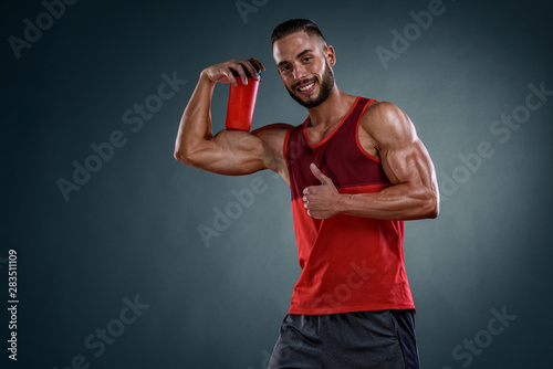 Handsome Muscular Men With Protein Drink Bottle