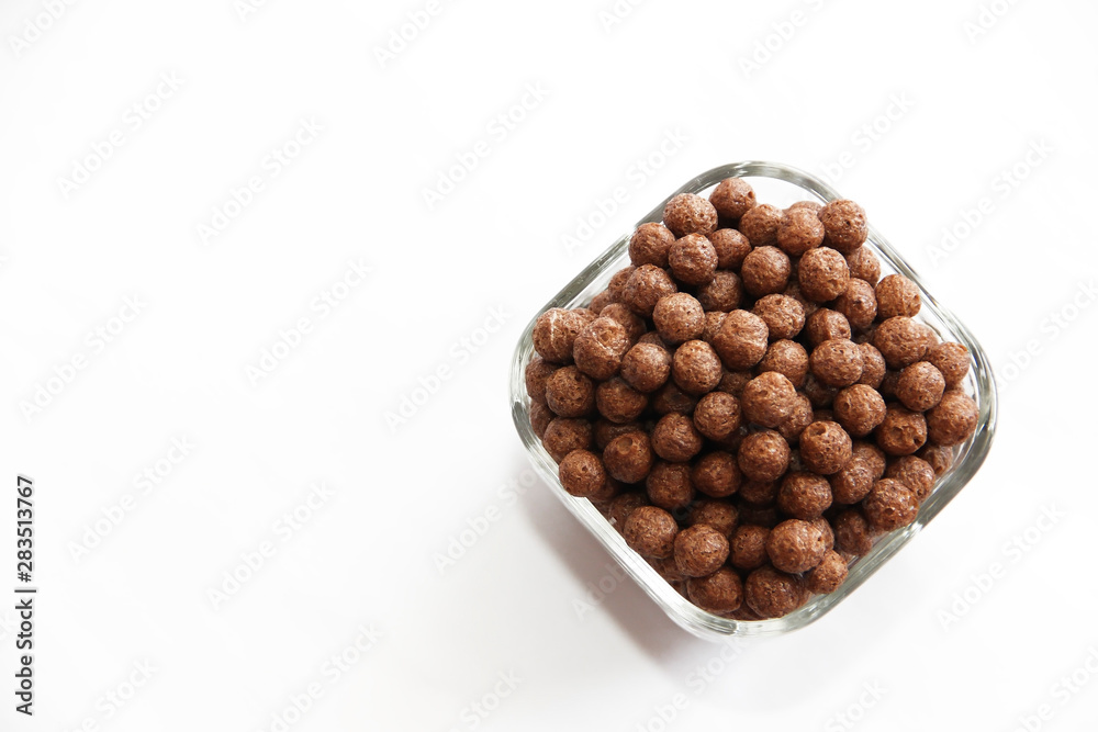 sweet corn chocolate balls in a glass plate on a white background sweet corn chocolate balls in a glass plate on a white background