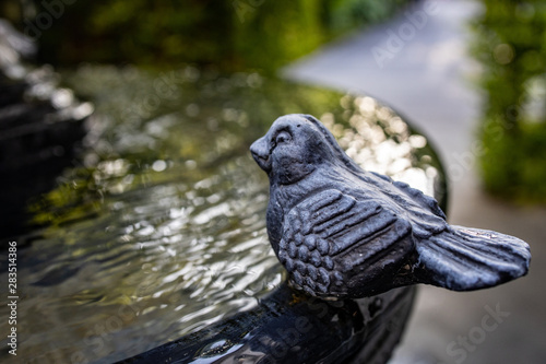 Stone bird at the fountain