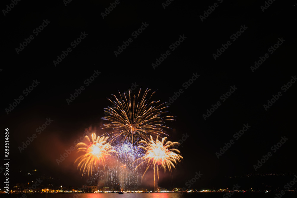 Firework show on Lake Garda, celebration (Sant Ercolano). In the city of Toscolano Maderno Italy. Aerial view. Firework show on Lake Garda, celebration (Sant Ercolano). In the city of Toscolano Maderno Italy. Aerial view.
