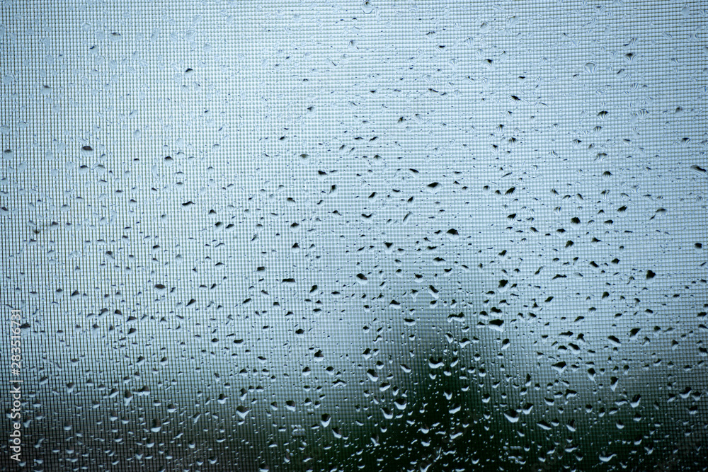 Raindrops on a mosquito net. Mosquito net on a window with a curtain. Horizontal photo, macro. Raindrops on a mosquito net. Mosquito net on a window with a curtain. Horizontal photo, macro.