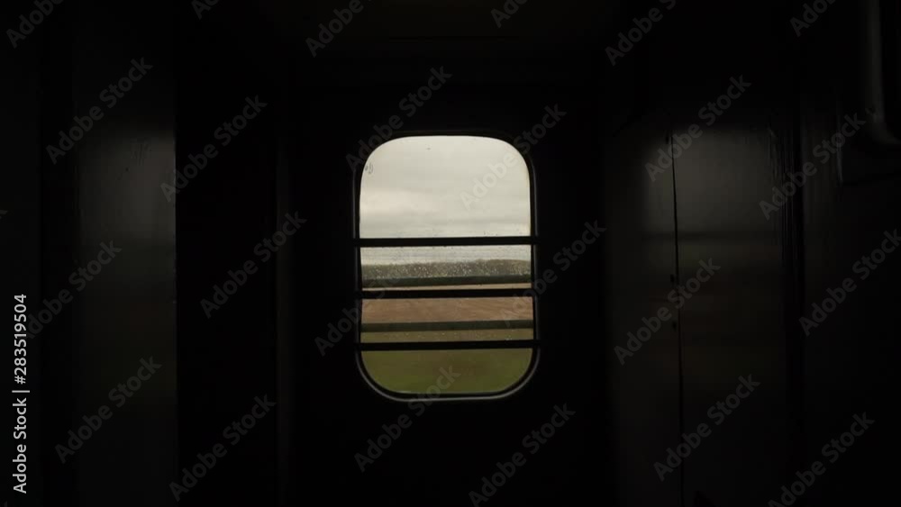 Train Window Glass. View from moving train side window Landscape Mountain Village Moody Cinematic Dramatic Shot