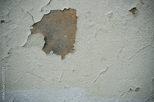Texture of an old wall covered with paint. Background image of a worn paint coated surface