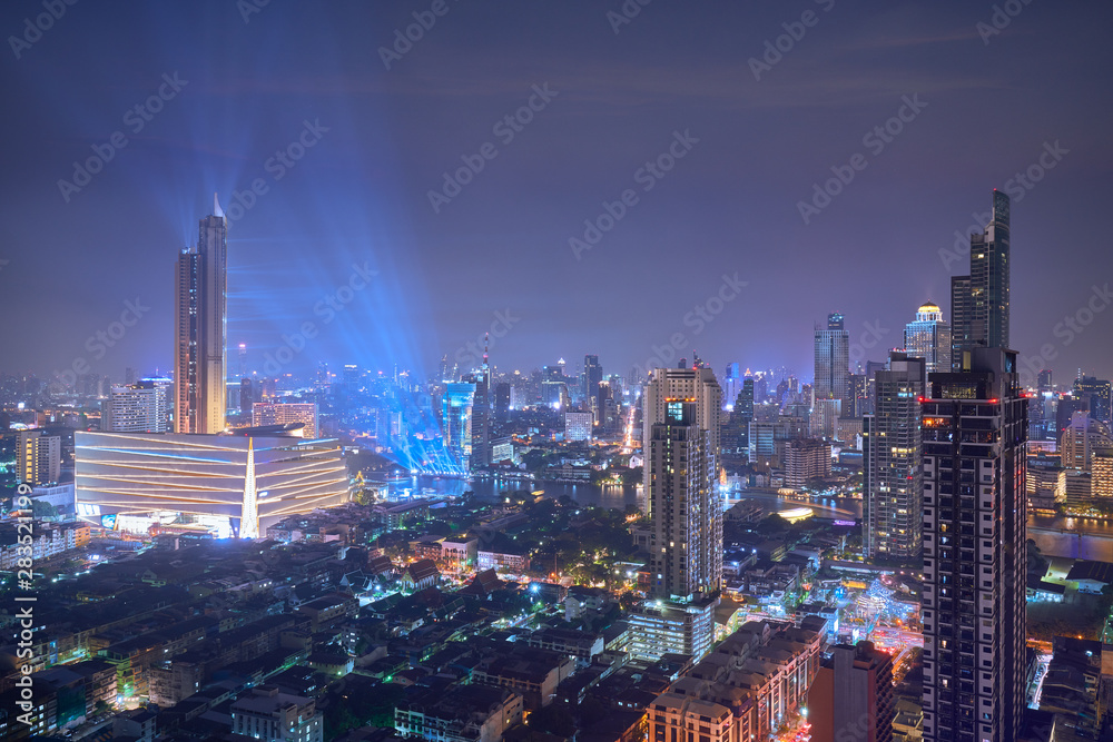 night cityscape view of chaopraya river and highest building in bangkok